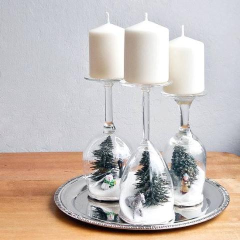 wine glasses with winter decor and candles